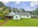 Charming single-Gathering home features a screened in porch and a brick path leading to backyard at 1789 Brandi Ln, Loganville, GA 30052