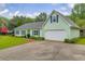 One-story home with blue shutters and a long driveway at 1789 Brandi Ln, Loganville, GA 30052