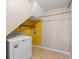 Well-lit laundry room with washer, dryer, and ample storage space at 1789 Brandi Ln, Loganville, GA 30052