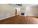 Inviting living room with fireplace, hardwood floors, and a ceiling fan at 1789 Brandi Ln, Loganville, GA 30052