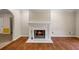 Charming fireplace, hardwood floors, and seamless flow into adjacent rooms at 1789 Brandi Ln, Loganville, GA 30052