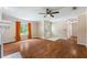 Bright living room boasting hardwood floors, large window, and ceiling fan at 1789 Brandi Ln, Loganville, GA 30052
