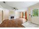 Cozy living room with fireplace, hardwood floors, and ample natural light at 1789 Brandi Ln, Loganville, GA 30052