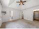 An airy main bedroom showing two ensuite bathrooms and a ceiling fan at 1789 Brandi Ln, Loganville, GA 30052