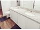 Modern bathroom featuring a double vanity with granite countertops, providing ample space and style at 20 Sloane Ct, Covington, GA 30016
