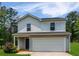 Charming two-story home featuring a two-car garage and well-maintained front yard and appealing color scheme at 20 Sloane Ct, Covington, GA 30016