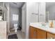 Neutral bathroom with a walk-in shower, toilet, and sink with a cabinet that provides extra storage at 2114 Gorman Se Grv, Atlanta, GA 30316