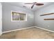 Bedroom with a ceiling fan, window, and wall shelves at 2114 Gorman Se Grv, Atlanta, GA 30316