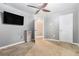 Neutral bedroom featuring a ceiling fan, and a wall-mounted television at 2114 Gorman Se Grv, Atlanta, GA 30316
