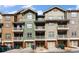 Attractive townhome exterior features colorful siding, balconies, and garage parking at 2114 Gorman Se Grv, Atlanta, GA 30316