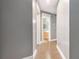 Hallway with wood floors leading to the bathroom at 2114 Gorman Se Grv, Atlanta, GA 30316