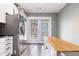 Bright kitchen features white cabinets, stainless steel appliances and hardwood flooring at 2114 Gorman Se Grv, Atlanta, GA 30316