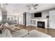 Bright living room featuring a fireplace, hardwood floors, and a comfortable couch at 2114 Gorman Se Grv, Atlanta, GA 30316