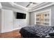 Primary bedroom with a TV, ceiling fan, and large window at 2114 Gorman Se Grv, Atlanta, GA 30316