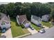Aerial view of a lovely suburban home with mature trees and green lawn at 3269 N Winds N Trl, Douglasville, GA 30135