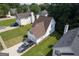 Aerial view of a white suburban home with a 2 car garage and mature landscaping at 3269 N Winds N Trl, Douglasville, GA 30135