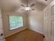 Bright bedroom features natural light from a large window and a ceiling fan at 3269 N Winds N Trl, Douglasville, GA 30135