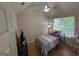 Cozy bedroom featuring a vaulted ceiling, ceiling fan, and a window providing natural light at 3269 N Winds N Trl, Douglasville, GA 30135