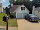 Charming home with a two-car garage and well-manicured lawn at 3269 N Winds N Trl, Douglasville, GA 30135