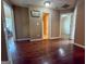 Spacious hallway with hardwood floors leading to different areas of the home at 3269 N Winds N Trl, Douglasville, GA 30135