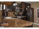 Inviting kitchen with stainless steel appliances, dark cabinets, and light countertops at 3269 N Winds N Trl, Douglasville, GA 30135