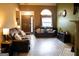 Comfortable living room with hardwood floors, large window, and cozy sofas at 3269 N Winds N Trl, Douglasville, GA 30135
