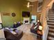 Inviting living room with a fireplace, comfortable seating, and a ceiling fan at 3269 N Winds N Trl, Douglasville, GA 30135