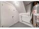 Basement featuring water heater and side door at 765 Martin Rd, Stone Mountain, GA 30088