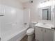 Bathroom featuring a tub and shower combo and single sink vanity at 765 Martin Rd, Stone Mountain, GA 30088