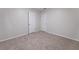 Bedroom featuring neutral carpet and two white doors at 765 Martin Rd, Stone Mountain, GA 30088