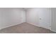 Bedroom featuring neutral carpet and two white doors at 765 Martin Rd, Stone Mountain, GA 30088