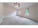 Large bedroom with two windows, neutral paint, and vaulted ceiling at 765 Martin Rd, Stone Mountain, GA 30088