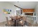 Cozy dining room with a wooden dining table and chair set, decorated with modern wall art at 765 Martin Rd, Stone Mountain, GA 30088