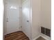 Welcoming entryway features a classic white door and wood-look floors at 765 Martin Rd, Stone Mountain, GA 30088