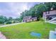 Charming two-story home with a two-car garage, stone accents, and a lush, green front yard at 765 Martin Rd, Stone Mountain, GA 30088