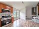 Eat-in kitchen area featuring stainless appliances and wood cabinets and modern flooring at 765 Martin Rd, Stone Mountain, GA 30088