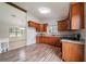 Bright kitchen features wood cabinets, granite countertops, and stainless steel appliances at 765 Martin Rd, Stone Mountain, GA 30088