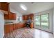Bright kitchen featuring wood cabinets, granite countertops, and stainless steel appliances at 765 Martin Rd, Stone Mountain, GA 30088