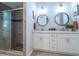 Modern bathroom with double vanity, updated cabinets, and a glass-enclosed shower at 2790 Barnwood Xing, Duluth, GA 30097