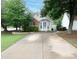 Charming home with a well-manicured lawn, beautiful trees, and a welcoming front exterior at 2790 Barnwood Xing, Duluth, GA 30097