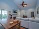 Open concept living room with hardwood floors, fireplace, and bright natural light at 2790 Barnwood Xing, Duluth, GA 30097