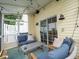 Relaxing screened-in porch with cozy furniture, ideal for enjoying outdoor living at 2790 Barnwood Xing, Duluth, GA 30097