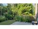 Tranquil backyard with flower garden and a patio area ideal for outdoor living at 3179 Woodward Down Trl, Buford, GA 30519