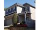 Lovely two-story home with brick and siding, showcasing well-maintained landscaping at 3179 Woodward Down Trl, Buford, GA 30519