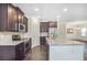 Modern kitchen with stainless steel appliances, granite countertops, and ample cabinet space at 3179 Woodward Down Trl, Buford, GA 30519