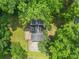 Aerial view of the home's backyard with the house surrounded by green trees at 3962 Fairington Dr, Marietta, GA 30066