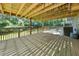 Spacious back deck shaded by the upper deck and featuring secure railings at 3962 Fairington Dr, Marietta, GA 30066