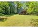 Expansive backyard with two-tiered deck, lush greenery, and mature trees at 3962 Fairington Dr, Marietta, GA 30066