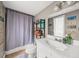 Well lit bathroom with a modern sink and vanity, featuring a tiled shower with curtain at 3962 Fairington Dr, Marietta, GA 30066