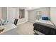 A cozy bedroom with a twin bed, desk, and organized storage space at 3962 Fairington Dr, Marietta, GA 30066